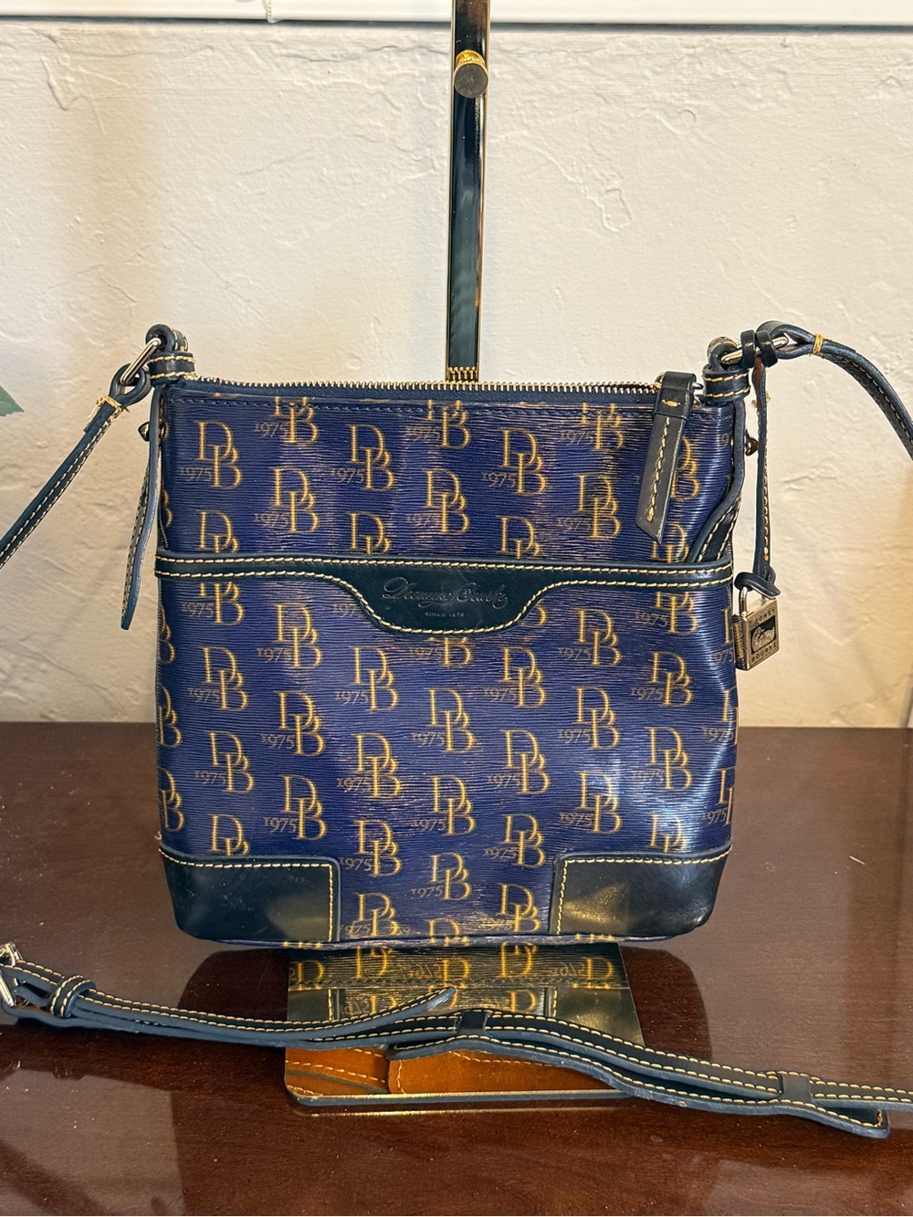 Dooney & Bourke Navy and Gold Logo Crossbody Bag